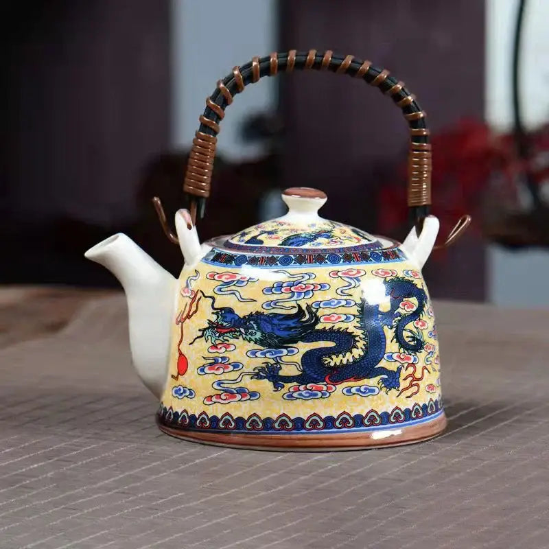 Blue and white porcelain teapot with vibrant yellow body, blue dragon design, bamboo handle for dining room decorbites blue set