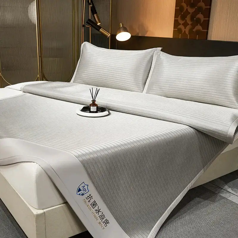 White ribbed cooling bed sheet with gray stripes and embroidered logo in decorbites cooling bed mat set for bedroom use