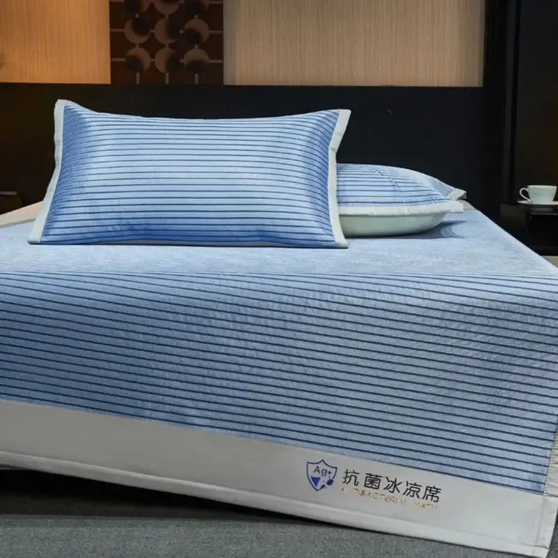 Blue and white striped cooling bed mat set with antibacterial decorbites cooling bed mat and white trim for bedroom use