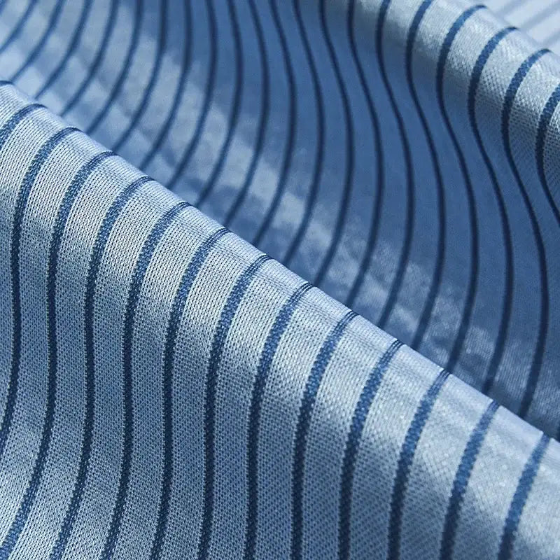 Light blue fabric with thin dark navy stripes on decorbites cooling bed mat set for bedroom sleeping comfort
