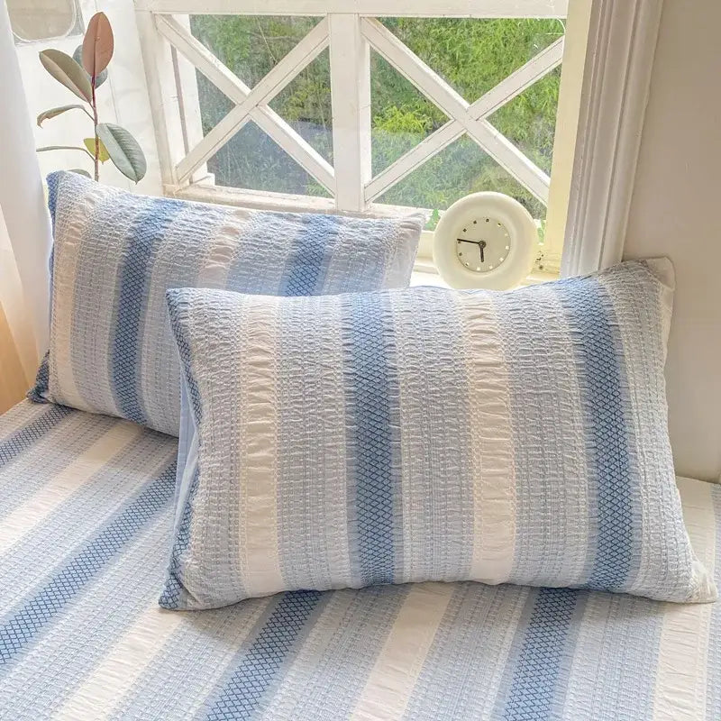 Blue and white striped cotton jacquard fitted sheet set with textured quilted pillowcases for bedroom use