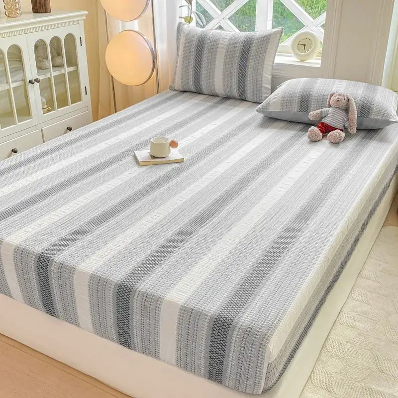 Gray and white striped cotton jacquard fitted sheet set with textured woven pattern for bedroom use