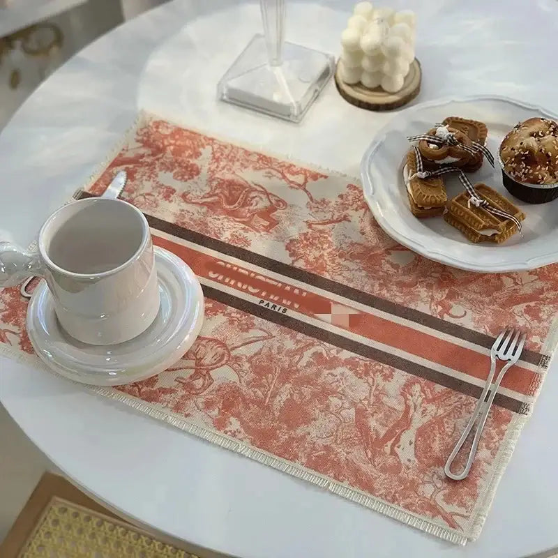 Rectangular cotton linen place mat with rust orange vintage toile pattern, bold stripes, and frayed edges for dining decorbites decor