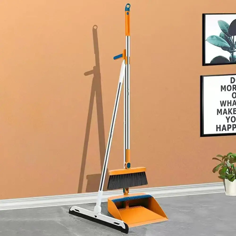 Orange and silver telescopic broom with black bristles paired with matching orange dustpan in broom scoop set