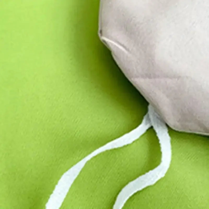 A soft light beige fabric pouch with white drawstring included with blue and yellow decorbites comfort king bedding set
