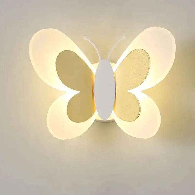 A butterfly girl cartoon wall light with translucent white wings emitting warm ambient light for cartoon children room