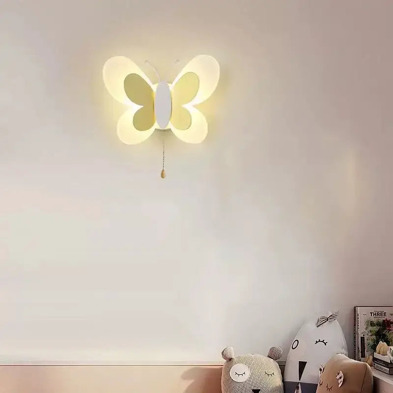 A soft yellow butterfly girl cartoon wall light with white center and warm glow for cartoon children room bedroom