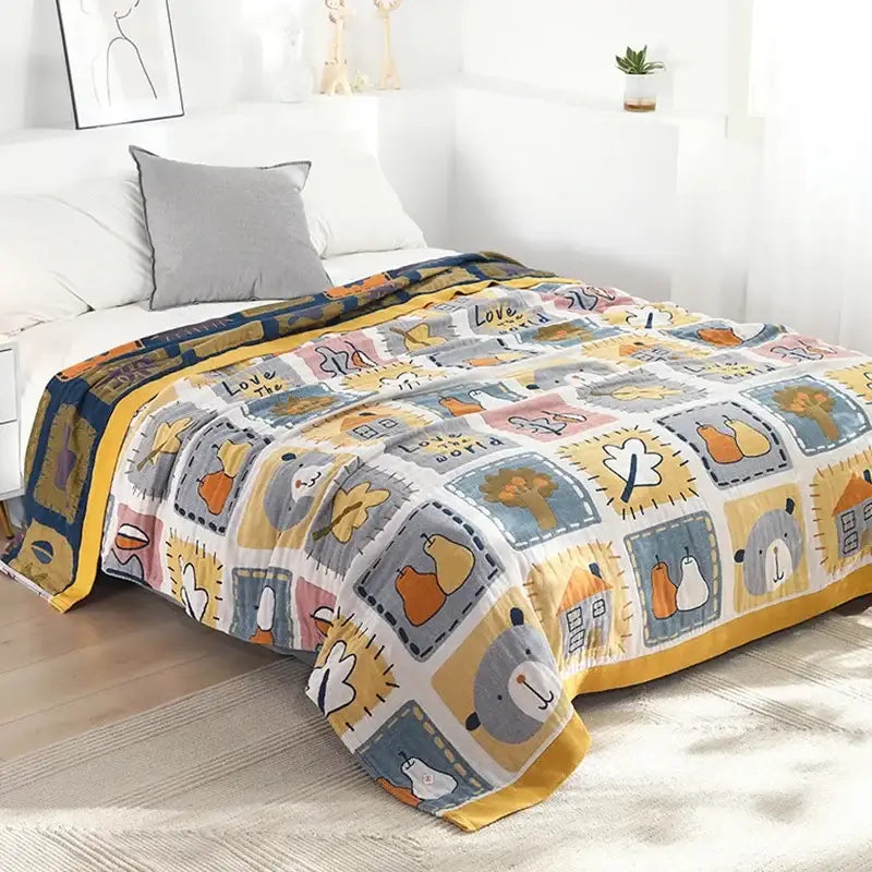 A cozy blue cartoon cat summer quilt featuring a multicolored cotton patchwork with playful nature motifs