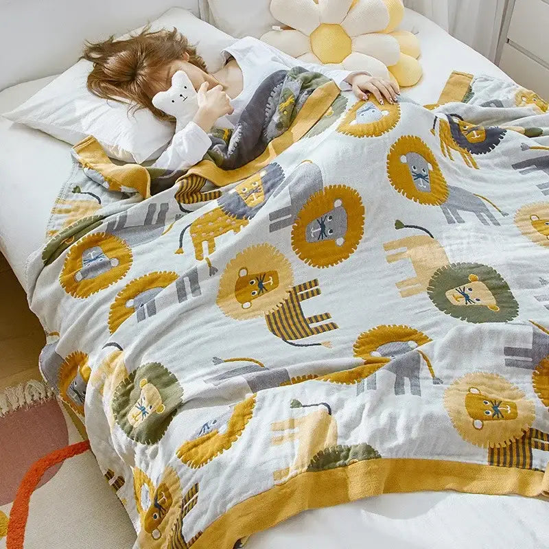 Blue cartoon cat summer quilt featuring a white cotton blanket with yellow and gray cartoon lions and mustard trim decorbites cartoon cat