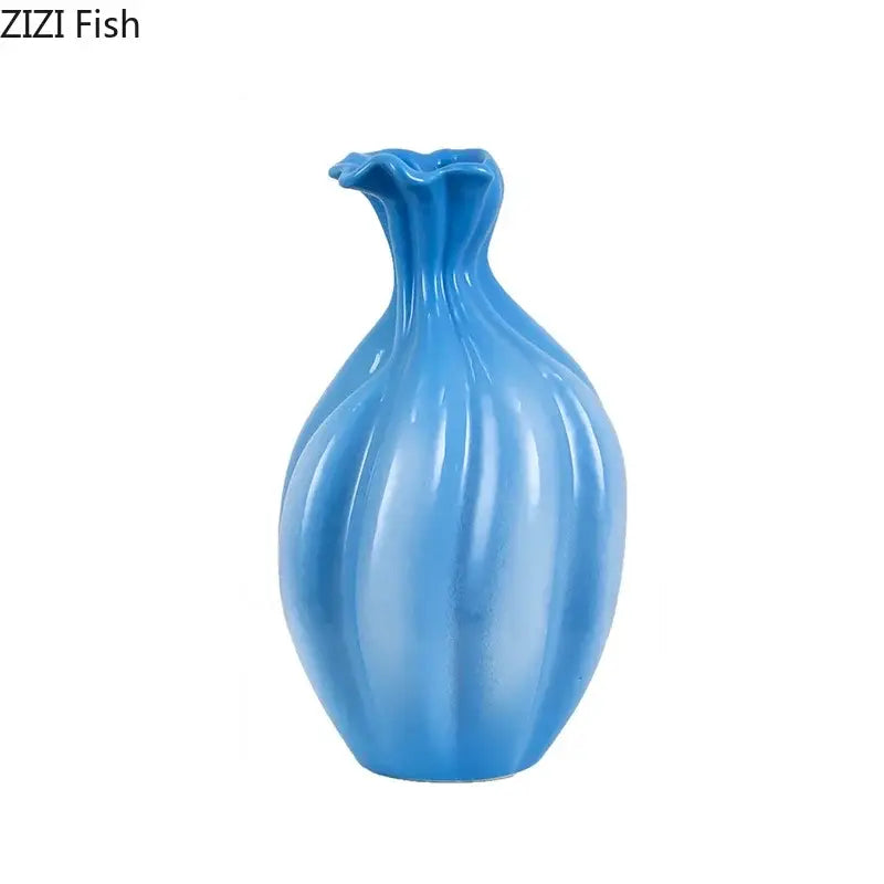 Glossy blue ceramic flower bud vase with fluted ribbed body and ruffled neck for decorbites blue ceramic decor