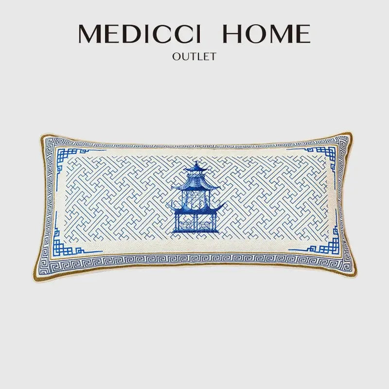 A rectangular blue chinoiserie home pagoda cushion cover with white embroidery and intricate geometric patterns