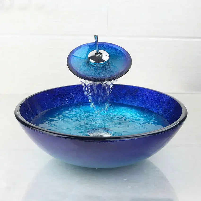Vibrant blue chrome tall waterfall sink set with glass sink and matching decorbites blue chrome circular faucet
