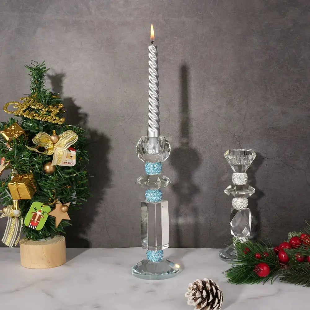 Silver twisted candle with flame in a decorbites blue diamond crystal glass holder with blue glitter accents for dining room decor