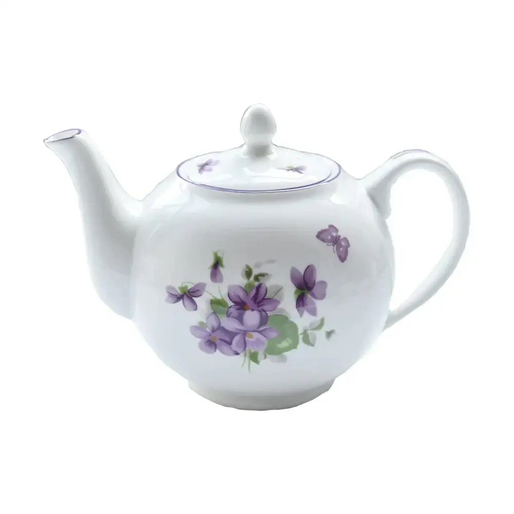 White porcelain teapot with delicate purple violet and butterfly motifs from the blue dream tea set for elegant dining
