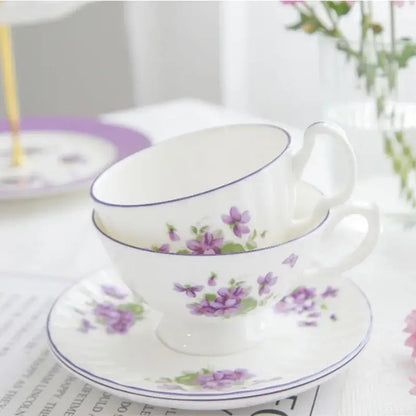 White porcelain tea set with delicate purple floral patterns and blue rim from blue dream tea collection