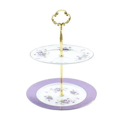Two-tiered dessert stand with gold handle and purple floral porcelain plates from blue dream tea set