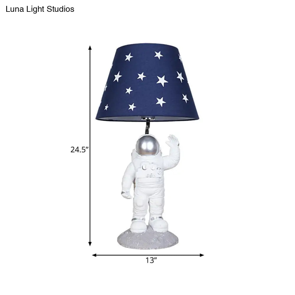 Blue Empire Shade Night Lamp - Kids Star Patterned Fabric Table Lighting with Carved Spaceman Base, 10"/13" Wide