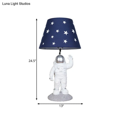 Blue Empire Shade Night Lamp - Kids Star Patterned Fabric Table Lighting with Carved Spaceman Base, 10"/13" Wide