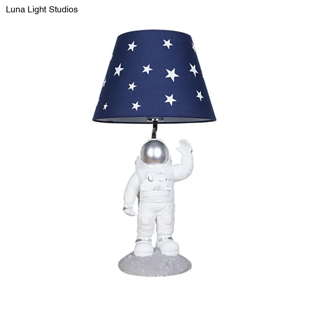 Blue Empire Shade Night Lamp - Kids Star Patterned Fabric Table Lighting with Carved Spaceman Base, 10"/13" Wide