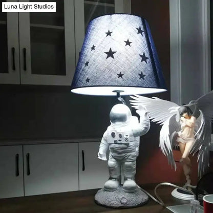 Blue Empire Shade Night Lamp - Kids Star Patterned Fabric Table Lighting with Carved Spaceman Base, 10"/13" Wide