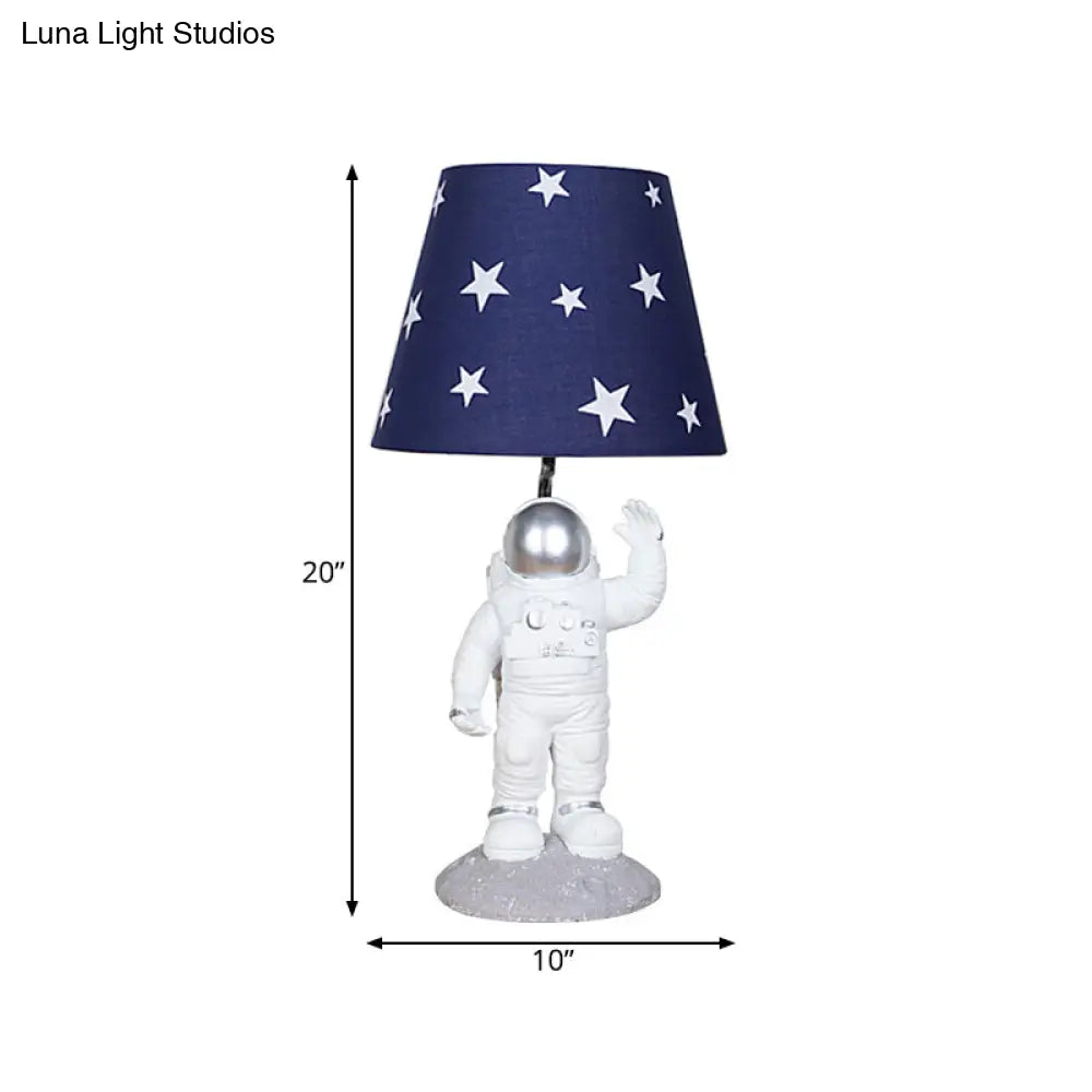 Blue Empire Shade Night Lamp - Kids Star Patterned Fabric Table Lighting with Carved Spaceman Base, 10"/13" Wide