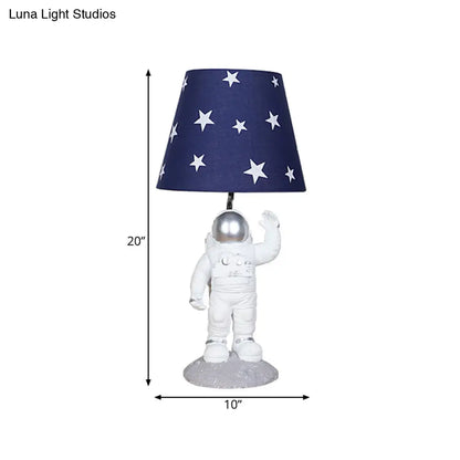 Blue Empire Shade Night Lamp - Kids Star Patterned Fabric Table Lighting with Carved Spaceman Base, 10"/13" Wide