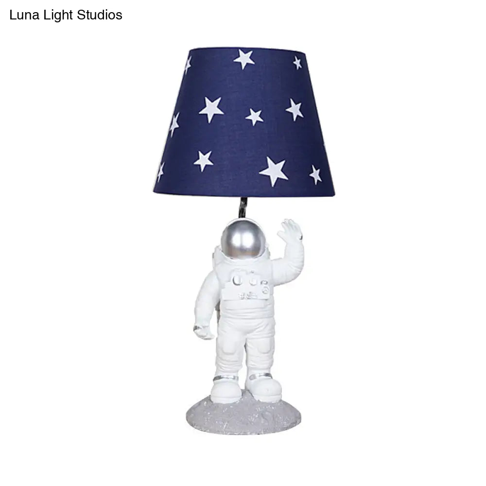 Blue Empire Shade Night Lamp - Kids Star Patterned Fabric Table Lighting with Carved Spaceman Base, 10"/13" Wide