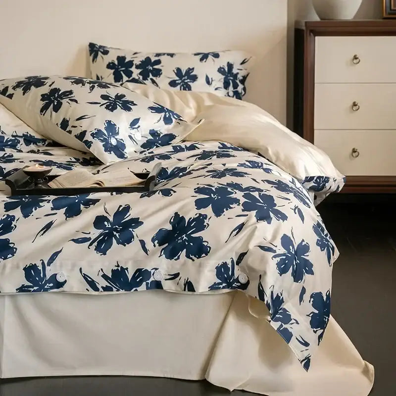 Cream-colored duvet cover with bold navy blue floral pattern in decorbites 100s egyptian cotton bedding set