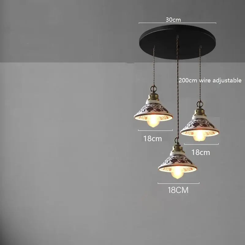 Three blue floral ceramic led pendant lamps with intricate brown and white patterns for dining room lighting decorbites ceramic led