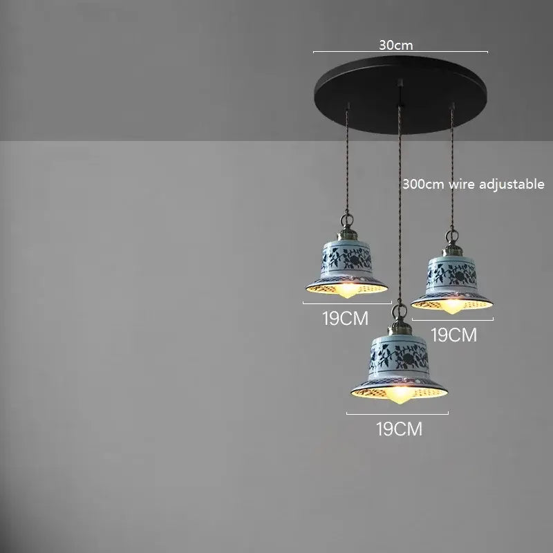 Three blue floral ceramic led pendant lamps hanging from a black ceiling mount decorbites ceramic led pendant lamp