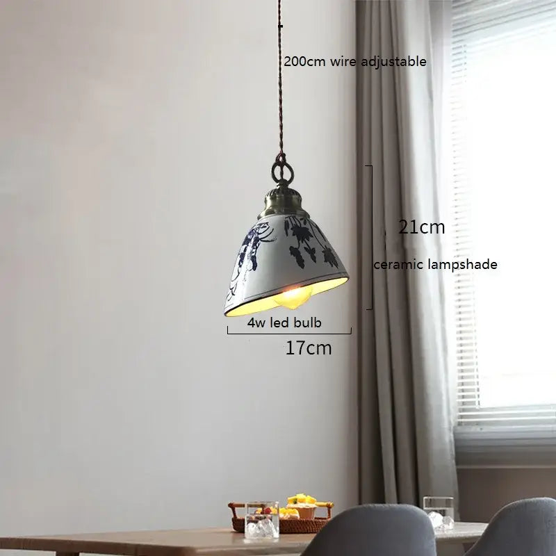 White ceramic led pendant lamp with blue floral patterns suspended by 200cm adjustable wire for dining room decorbites ceramic led