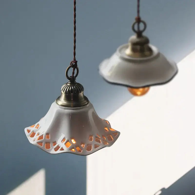 White ceramic led pendant lamp with lace-like cutouts and brass top for dining room decorbites ceramic led lighting