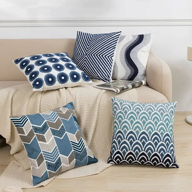 Set of five decorbites blue floral cushion covers with blue floral geometric wave and geometric patterns on textured fabric