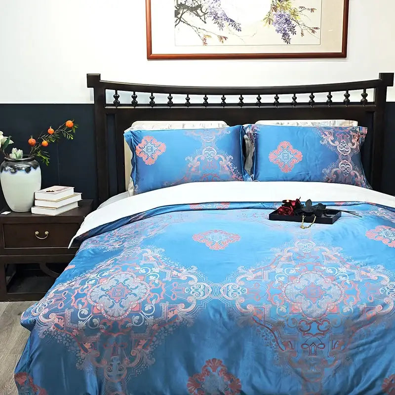 Blue floral satin jacquard duvet cover set in blue satin with intricate pink and white ornamental patterns by decorbites