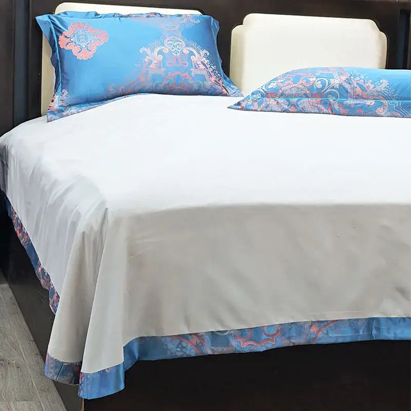 Blue floral satin jacquard duvet cover set featuring blue satin pillowcases with intricate pink and white floral patterns