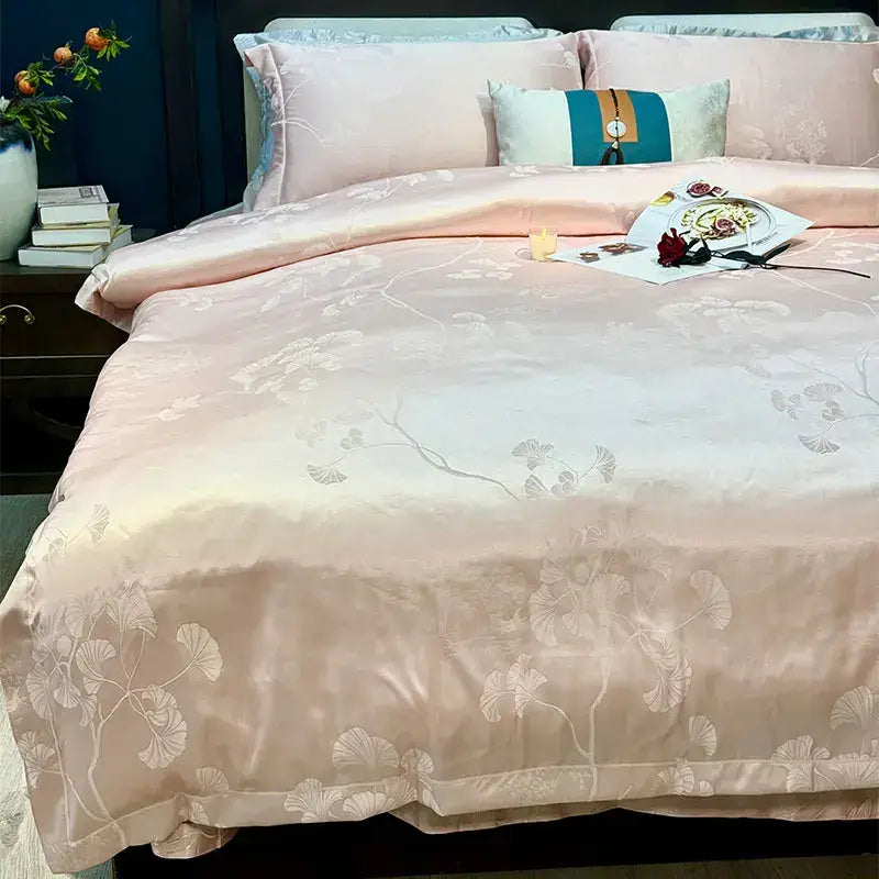 A soft blush pink satin duvet cover with silver ginkgo leaves pattern in decorbites blue satin jacquard bedding set