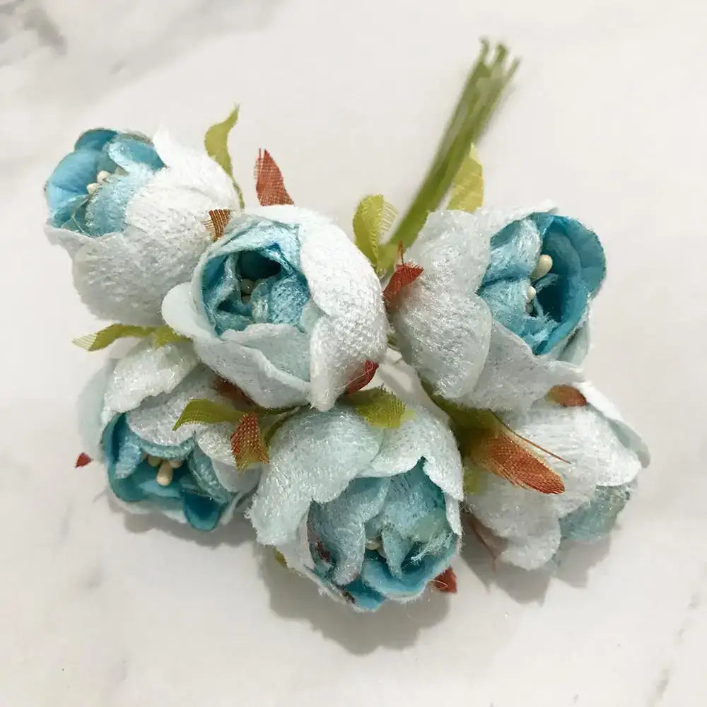 A delicate decorbites blue flower cherry stamen berries bundle with soft white blue petals and orange feather accents for living room decor