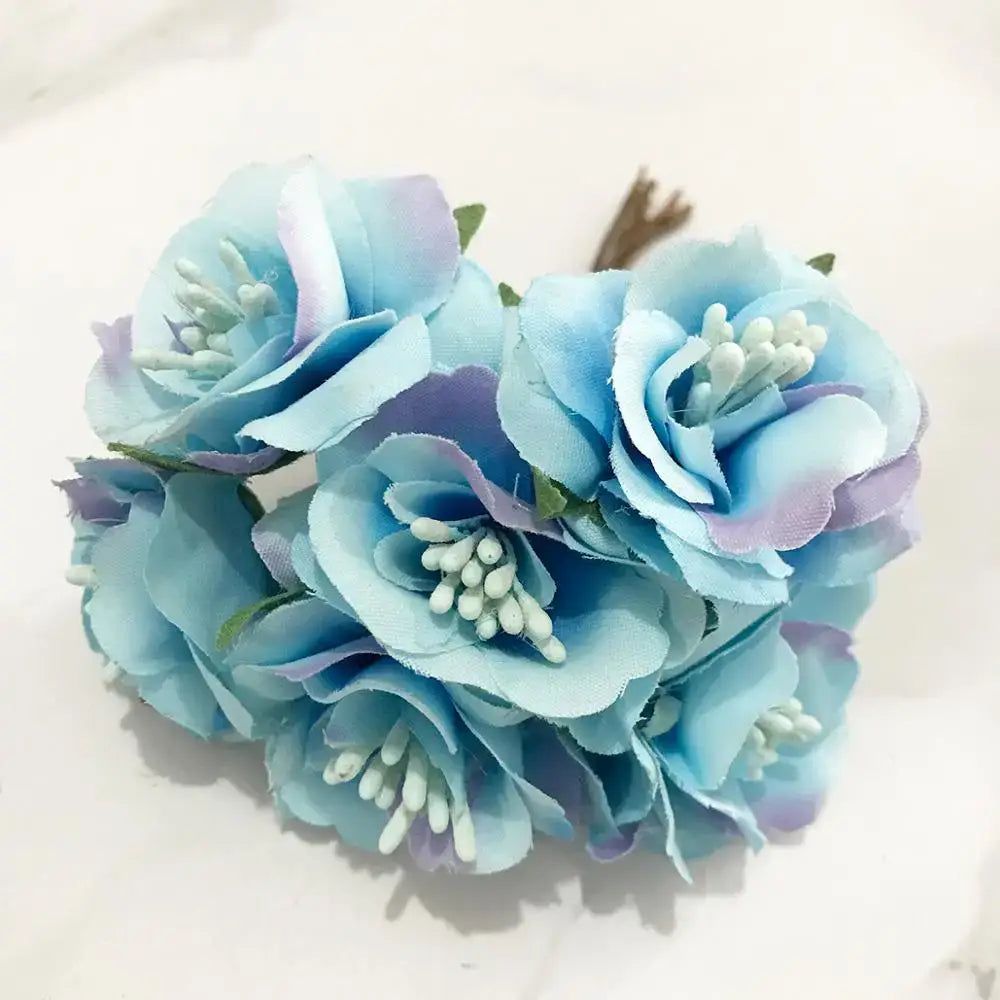 A cluster of delicate blue flower cherry stamen artificial roses with soft fabric petals for living room decorbites decor