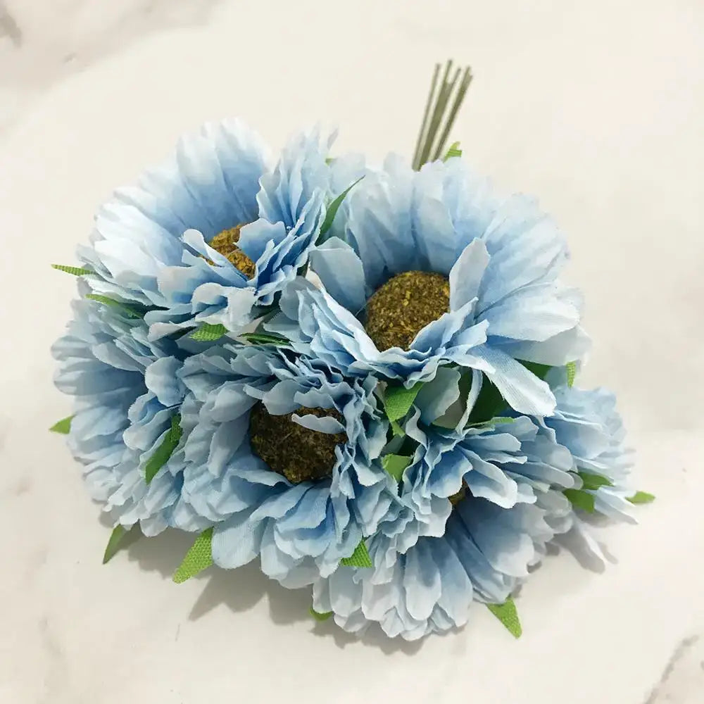 A delicate decorbites blue flower cherry stamen artificial bouquet with light blue petals and golden textured centers