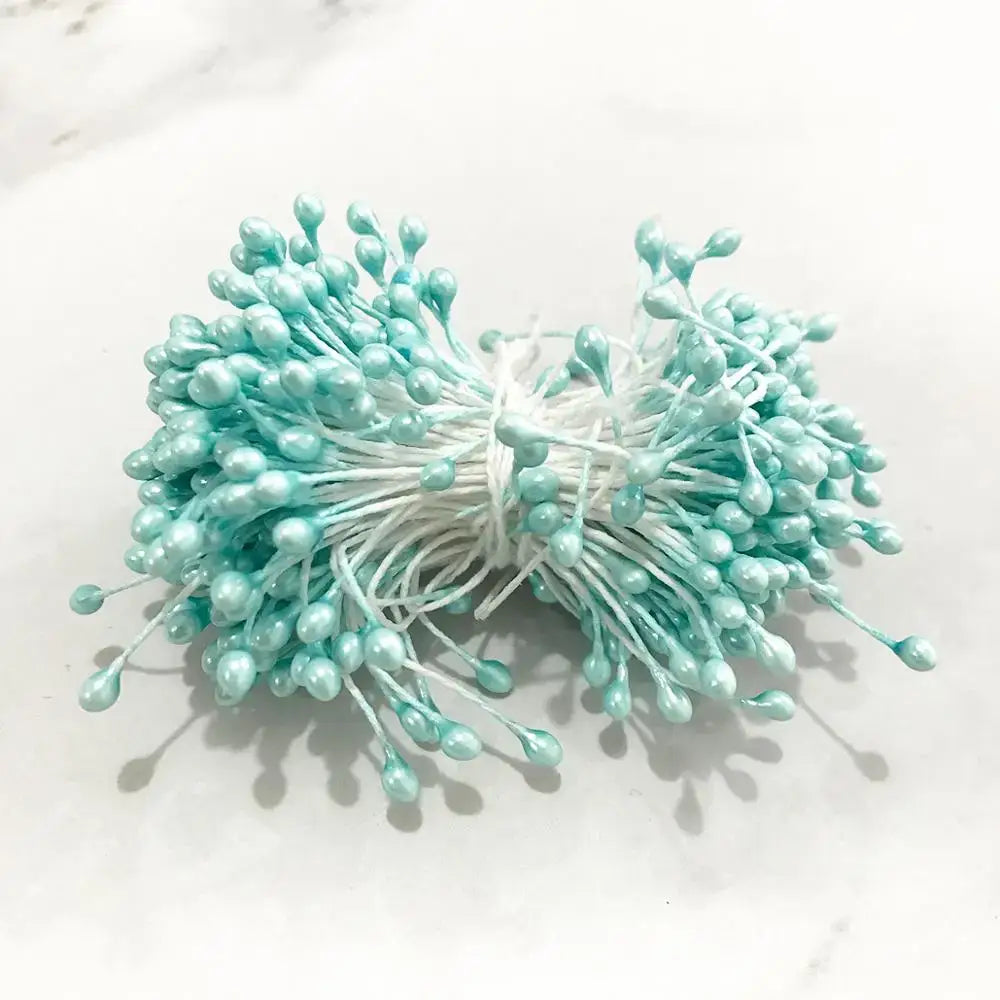 A bundle of delicate mint-green paper flower cherry stamen berries with thin white stems for decorbites blue flower decor