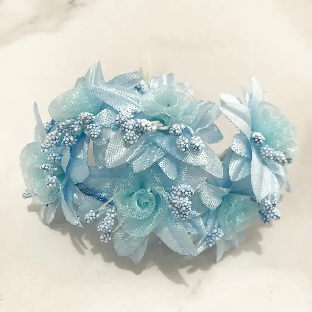 A decorbites blue flower cherry bundle featuring a light blue floral headpiece with mesh petals and silver beads for decor