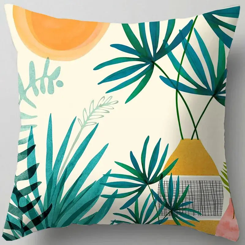 Square throw pillow with decorbites blue flower leaves pattern featuring teal palm leaves and yellow vase on cream background