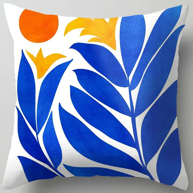 Blue flower leaves pattern square throw pillow with bold deep blue leaves and orange-yellow sunflowers on white background