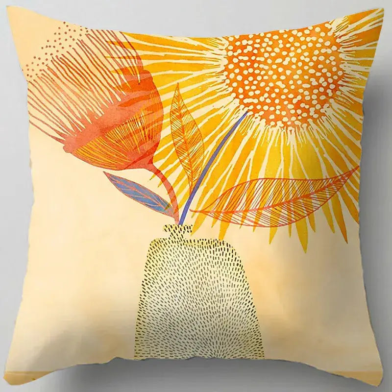 A square throw pillow with a blue flower leaves pattern featuring sunflowers in warm tones on cream decorbites blue flower