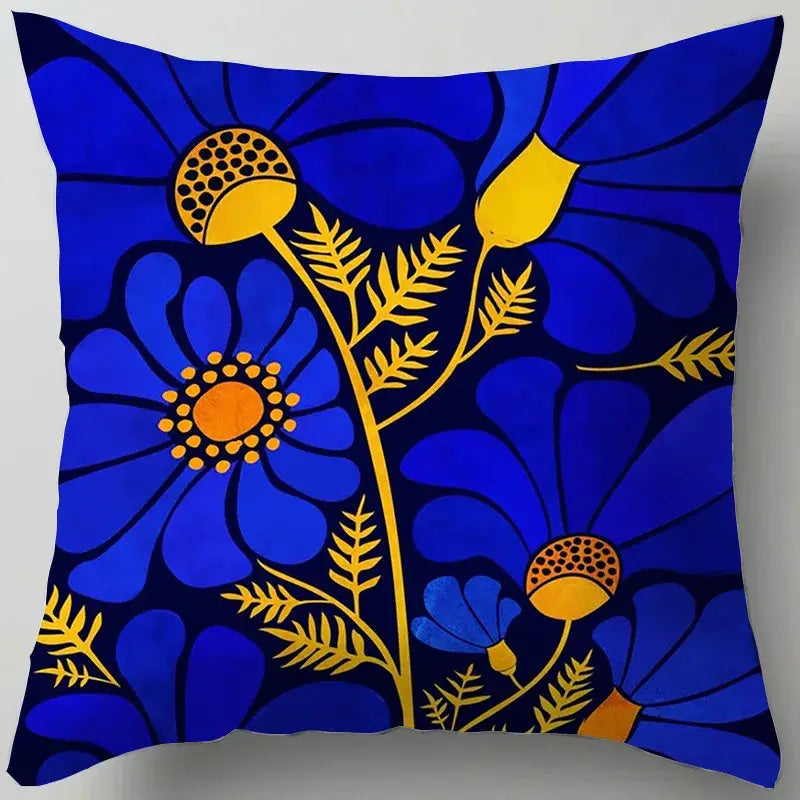 Blue flower leaves pattern cushion cover with vibrant blue throw pillow and stylized yellow orange floral decorbites blue flower