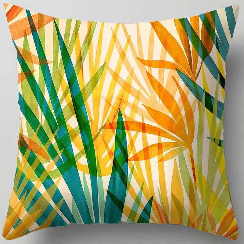 A decorbites blue flower leaves pattern cushion cover featuring vibrant green yellow teal foliage on cream background