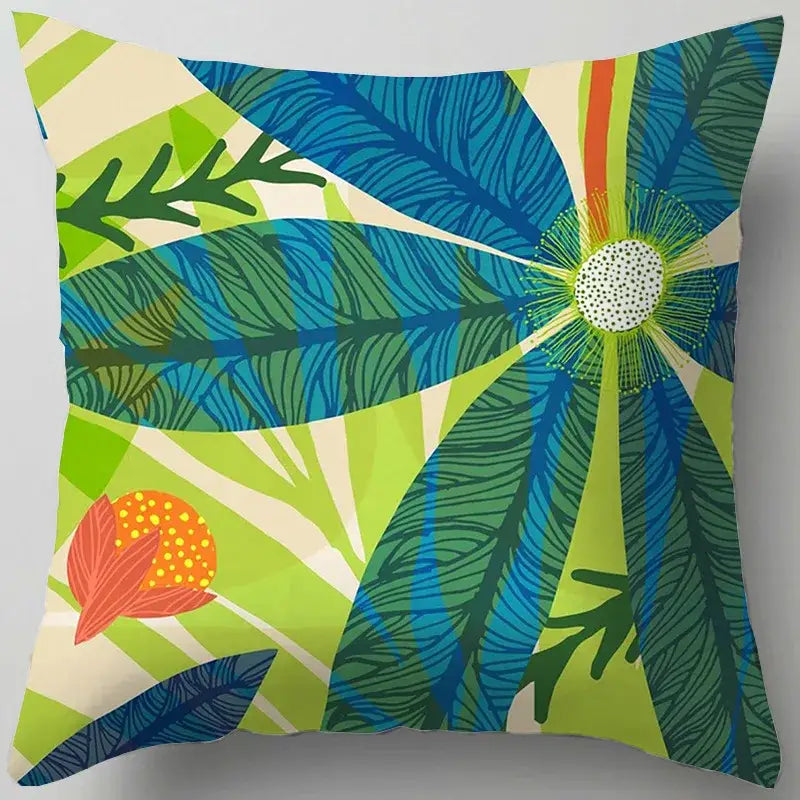 Vibrant tropical-themed square living room throw pillow with bold blue flower leaves pattern on a cream background