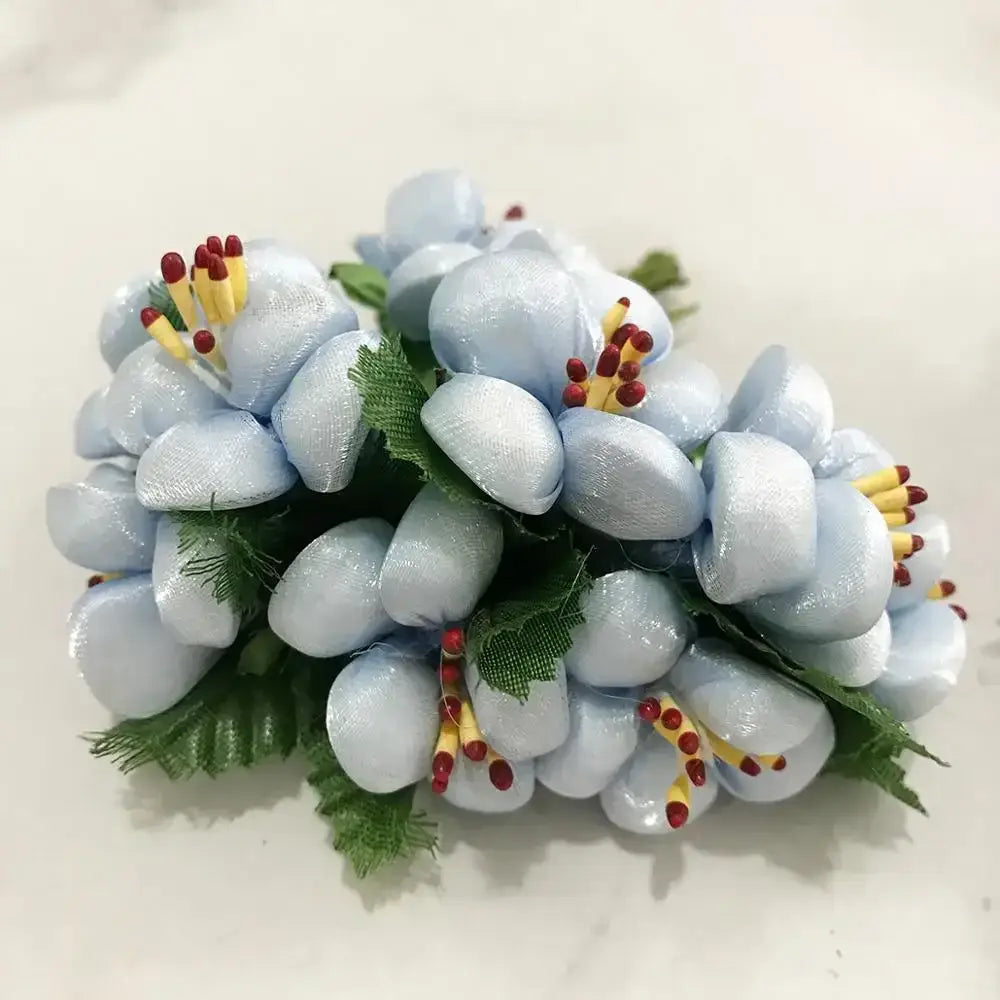 A stamen berries bundle featuring blue flower stamen satin fabric flowers with yellow red stamens and green leaves for decor