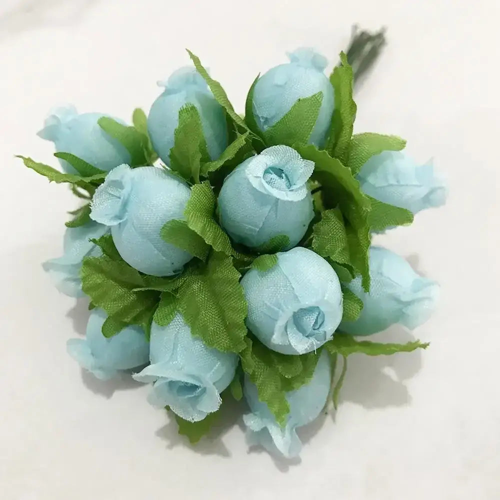 A delicate stamen berries bundle of light blue fabric blue flower stamen with green leaf accents for cake decor
