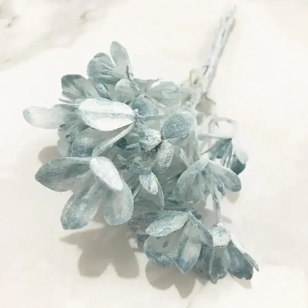 A delicate blue flower stamen berries bundle with frosty light blue and white artificial hydrangea blossoms for cake decor